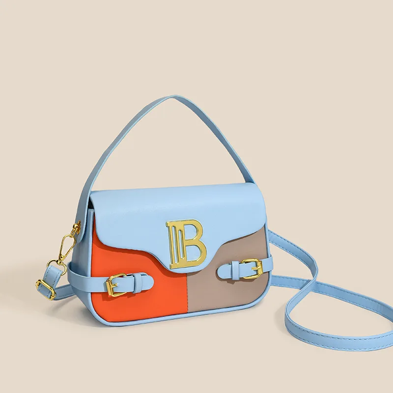 Luxury women's crossbody bag with color-blocking and stitching, box-style multi-color textured light luxury commuter bag.