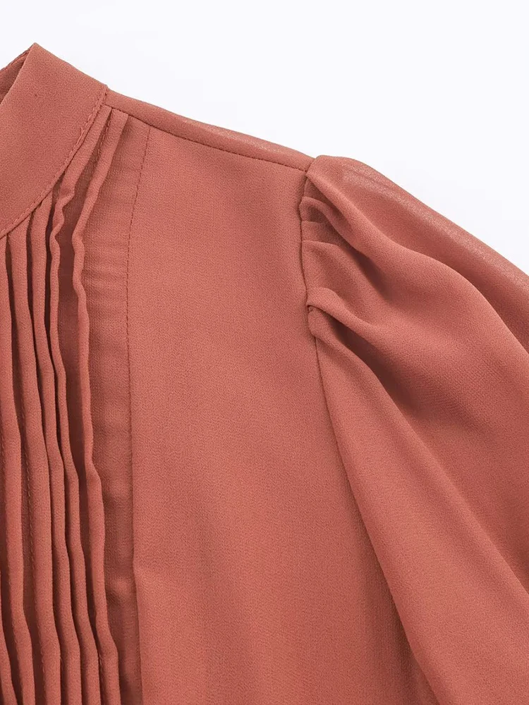 New European-style women's dress, fashionable and versatile, featuring an elegant design with ruffled details and long sleeves.