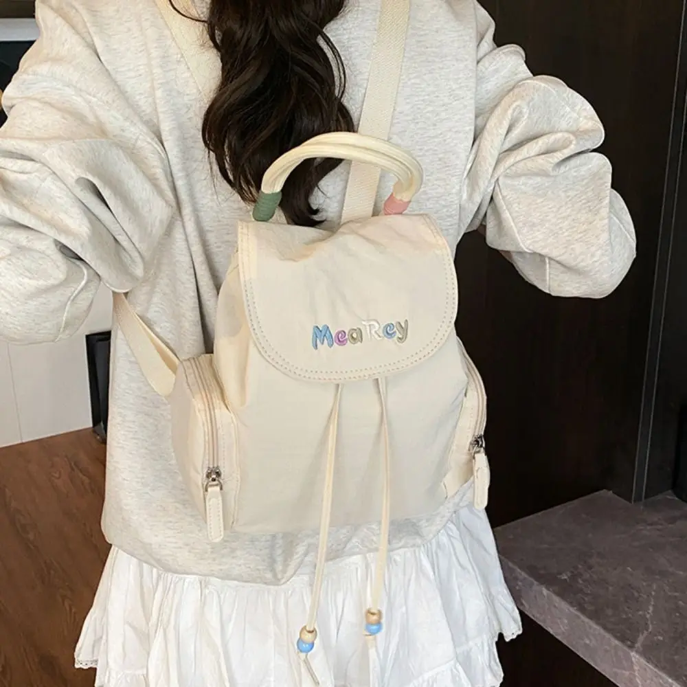 

Letter Embroidery Drawstring Backpack Solid Color Nylon Students School Bag Korean Style Large Capacity Shoulder Bag Travel