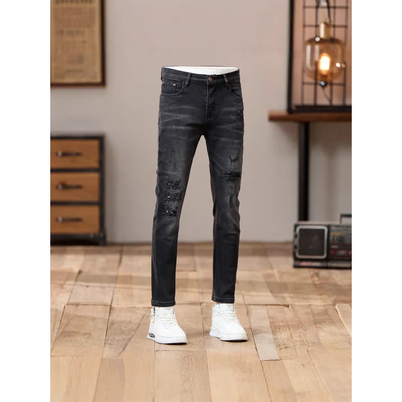 Jeans grigi neri con toppa graffiata da uomo autunno 2025 nuovo articolo retrò stile americano pantaloni a gamba piccola elastici cool e slim fit