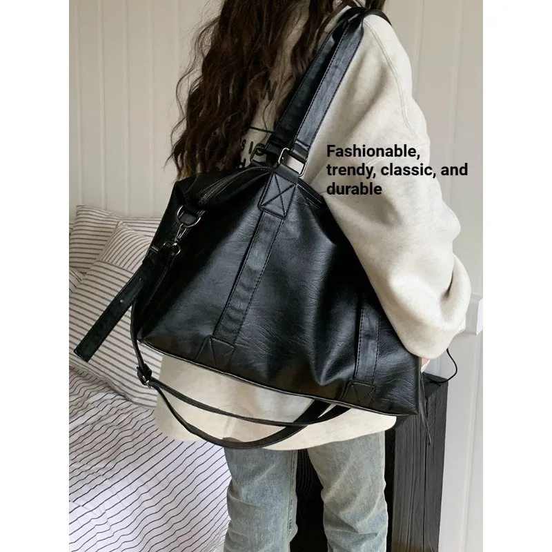 

Fashionable and cool men's and women's hand-held travel bags 2026 new Korean casual tote bag large capacity crossbody bag