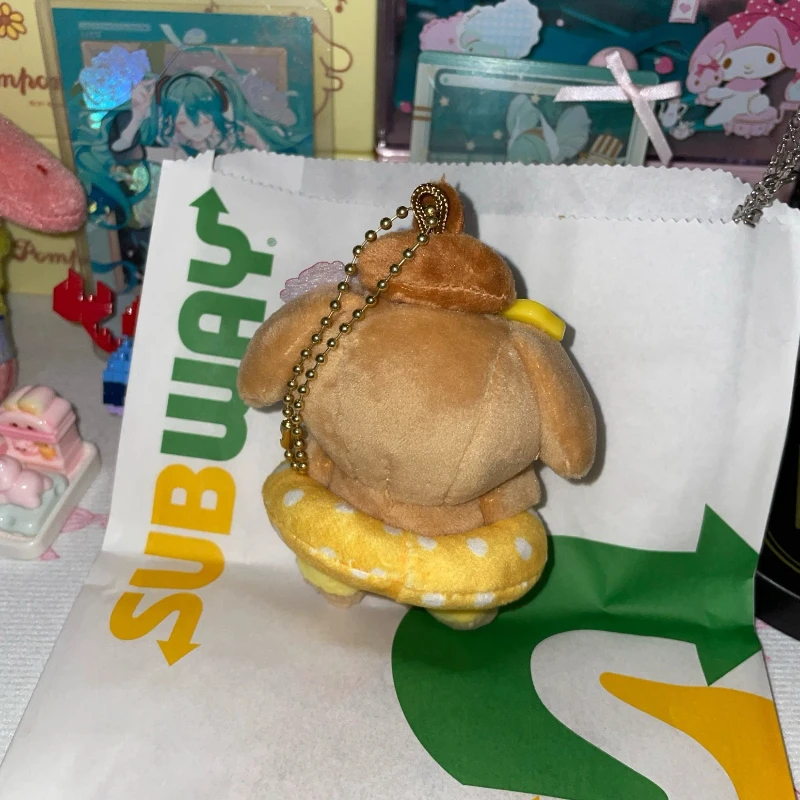 Zwart lederen zwemringen Pudding Hond Poppen Leuke cartoonanimatie Perifere knuffels Rugzakken Pluche hangers Meisjescadeau