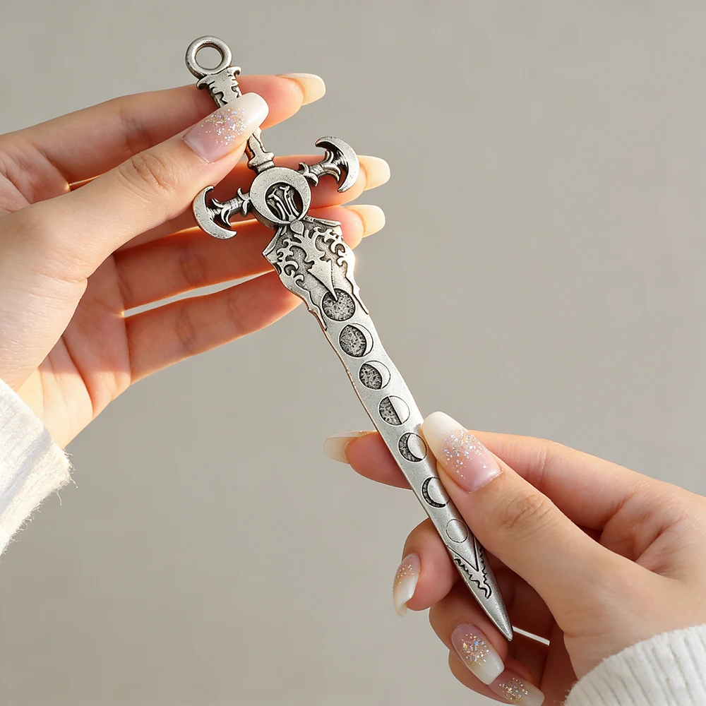 Silver Sword-Shaped Hair Stick Ornate Moon Phase Details Fantasy Design Perfect Cosplay Mystical Looks Bold Styling Accessory