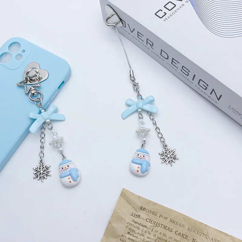 สายคล้องโทรศัพท์มือถือลายการ์ตูนน่ารัก รูปเกล็ดหิมะและตุ๊กตาหิมะ สำหรับฤดูหนาว  แบบหวานๆ อเนกประสงค์ เหมาะสำหรับสาวๆ แฟนสาว  ใช้คล้องกระเป๋าได้