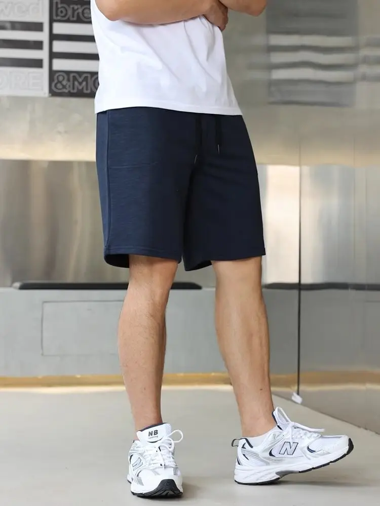 

Summer and autumn simple looped loose straight tube sports and leisure pure color combed cotton beach shorts for men
