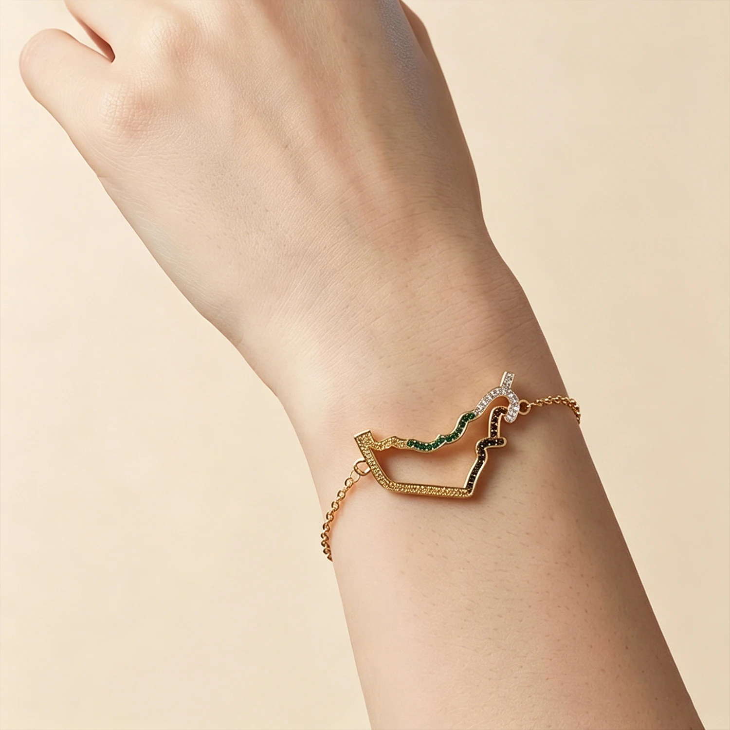 

Patriotic UAE Map Crystal Design This stunning bracelet features a polished gold finish with a detailed map of the UAE, encruste