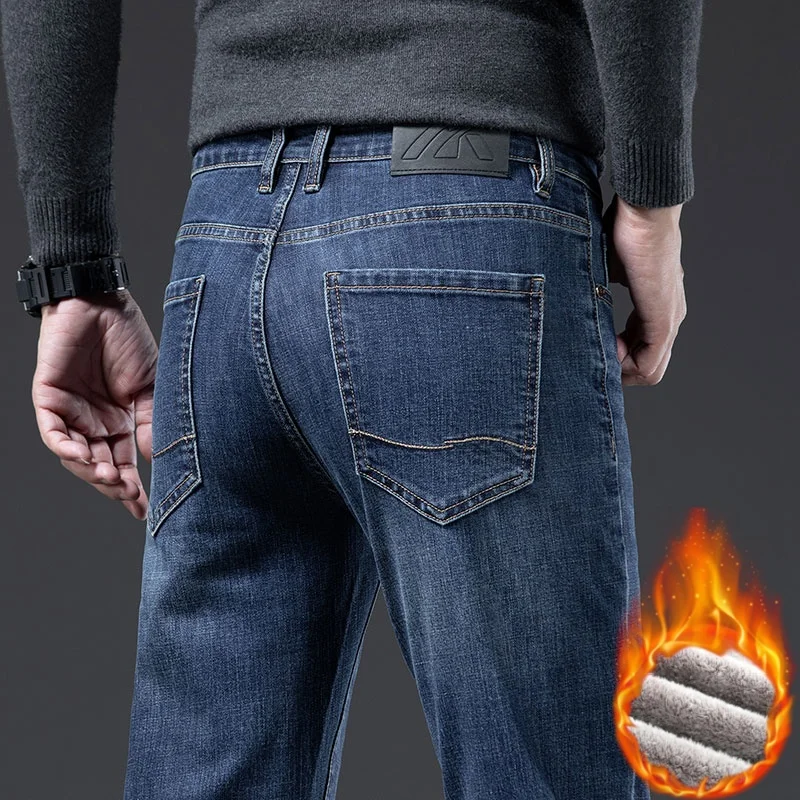 Nuovi jeans spessi invernali per pantaloni in denim dritti sottili elastici caldi in pile da uomo Pantaloni casual in velluto da lavoro Pantaloni da uomo di marca