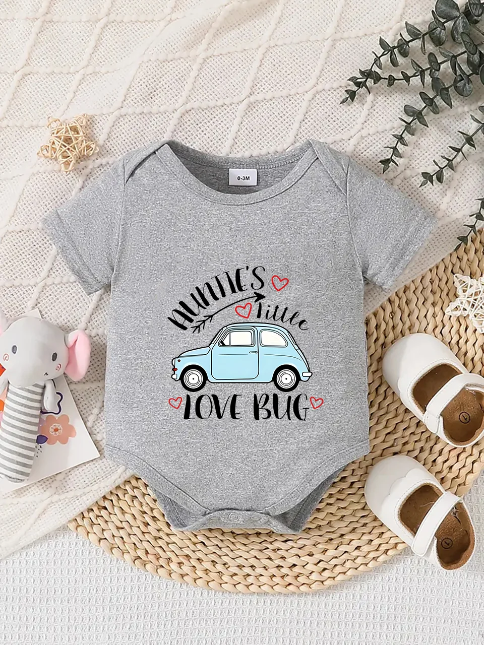 Playful letter-printed baby short-sleeve triangle bodysuit. Button closure for easy dressing, machine washable