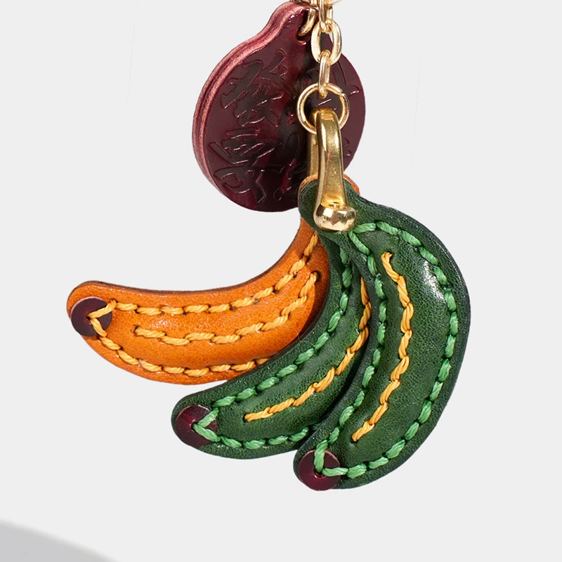 

Handmade genuine leather keychain bag charm pure handmade top grain cowhide small banana leather bag pendant