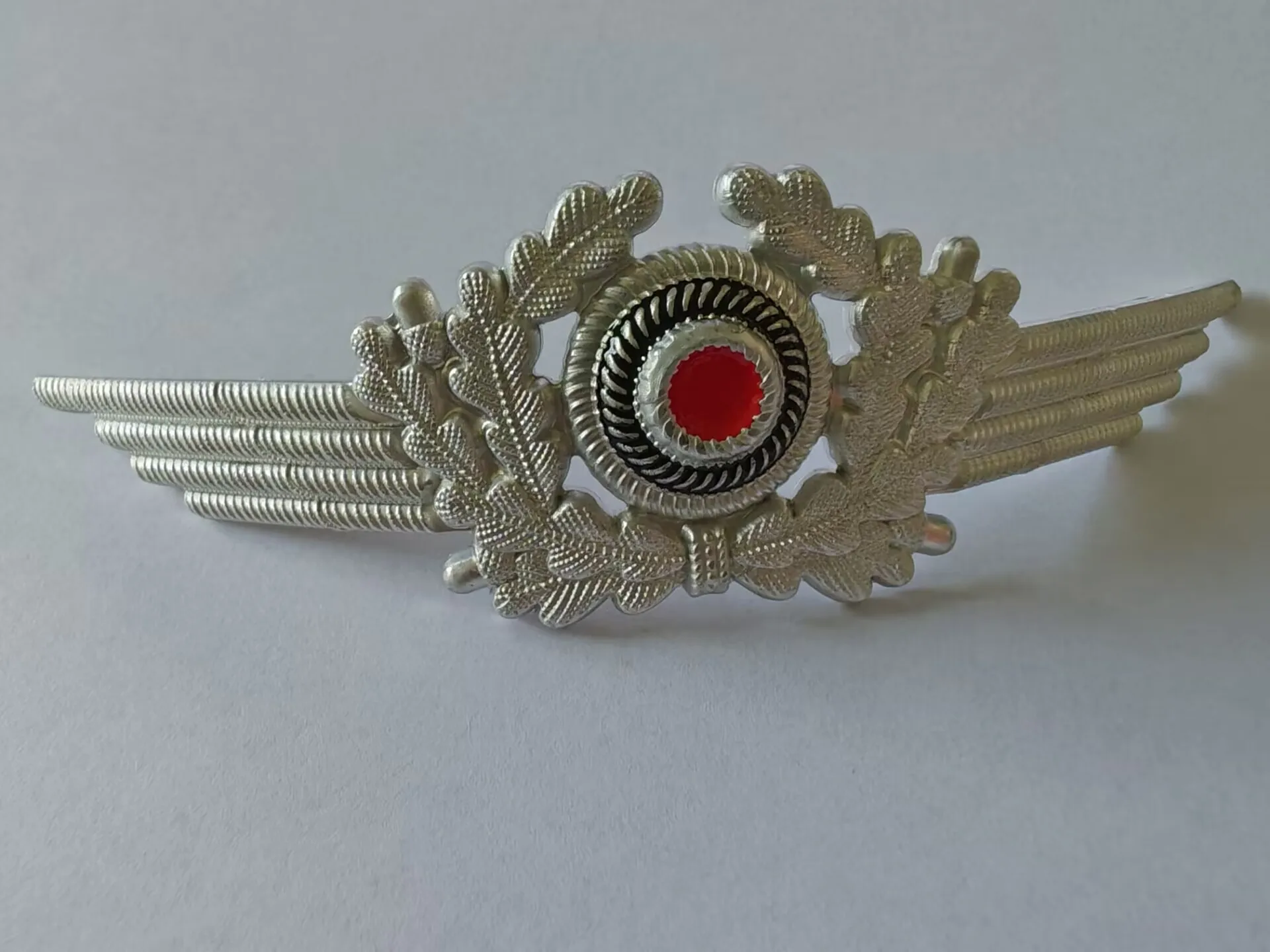 EMD LW Aluminum cap badge with an eagle