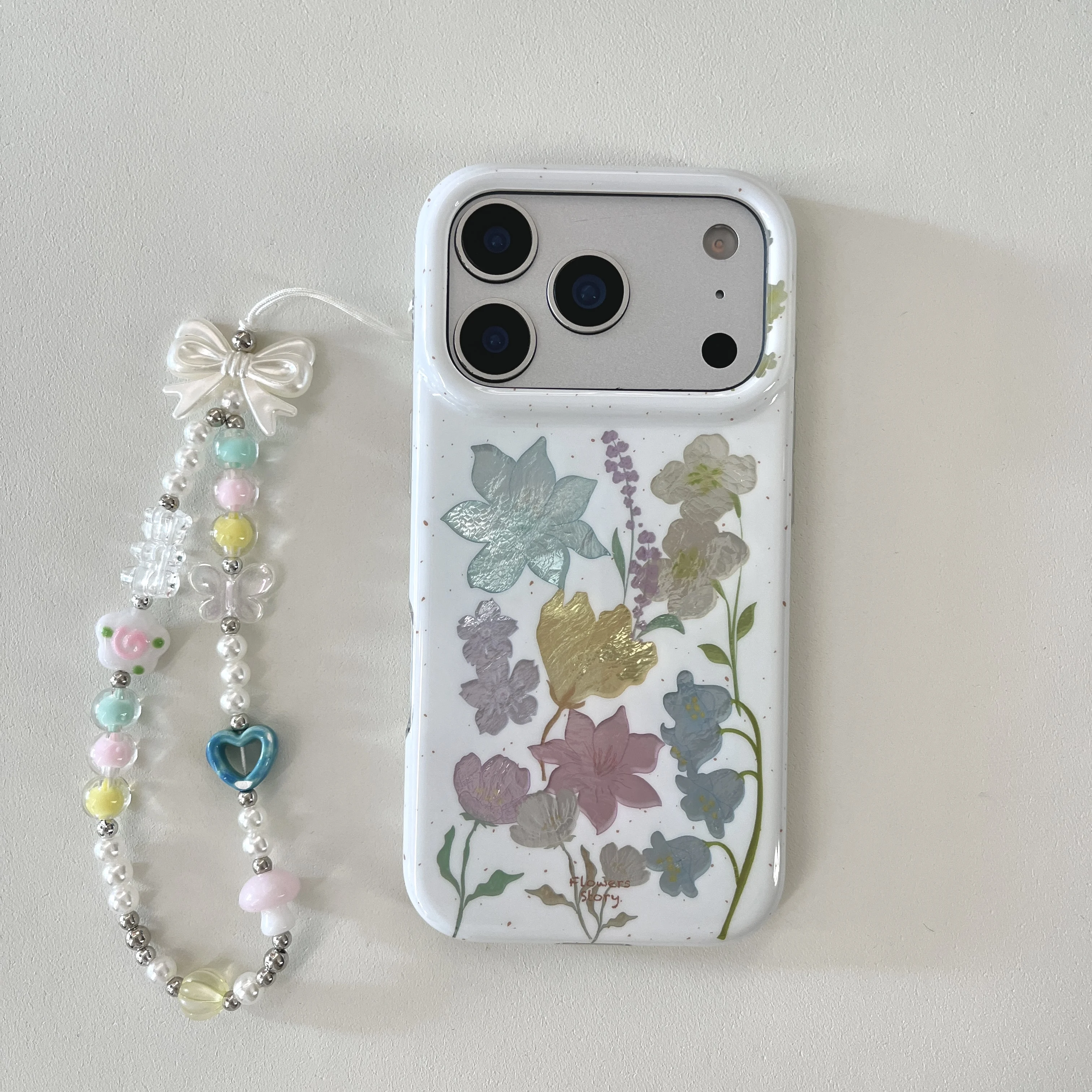 Coque de téléphone antichoc motif lys de la vallée laser tendance avec perles cœur et étoile pour iPhone 17 16 15 Pro Max