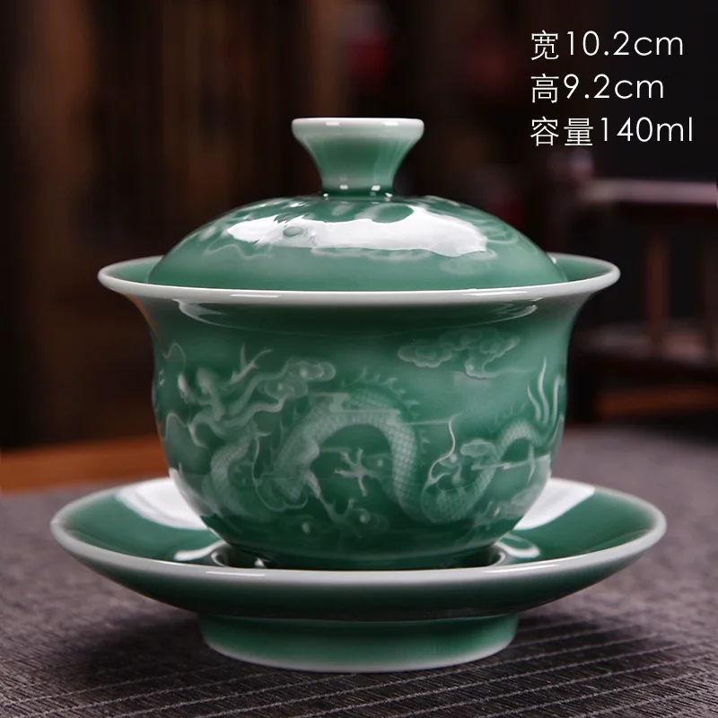 Three piece set of Chinese green glazed dragon patterned master tea cups