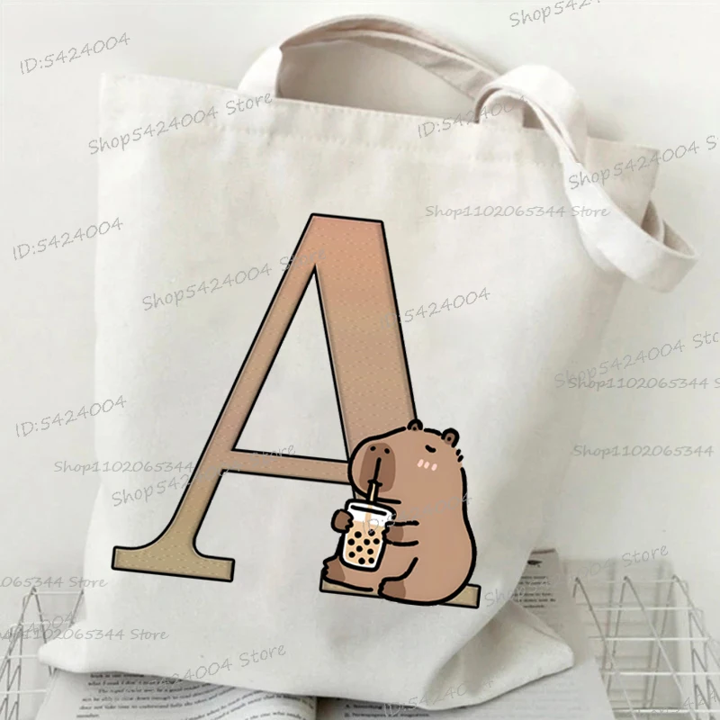 

Capybara Letters A B C D Print Canvas Shoulder Bag Kawaii Boba Capybaras Teenager Hiking Trekking Bags 26 Alphabet Storage Bags