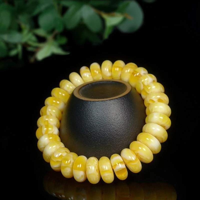 New Baltic Sea bracelet with amber , gold, star moon designs, wheel and abacus-shaped separator beads