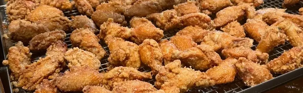 Chicken lifted out of basket lift fryer