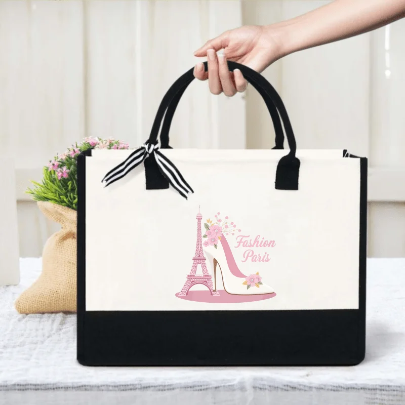 Stylish handbag in cream and black Eiffel Tower heels with floral design with stylish Parisian text for shopping and everyday us