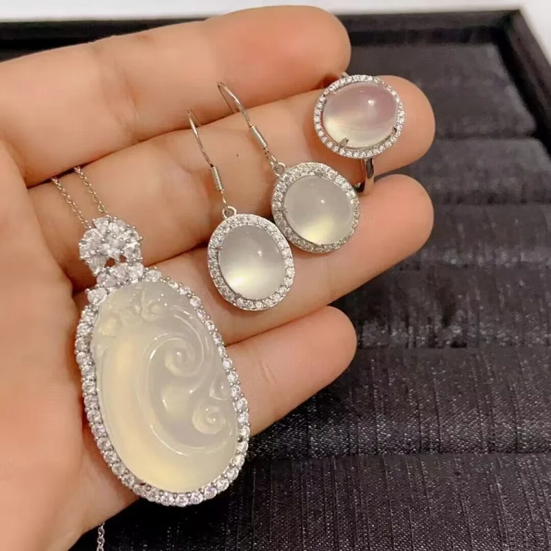 Silver-plated set with ice white chalcedony agate, including a Buddha pendant, earrings, and ring