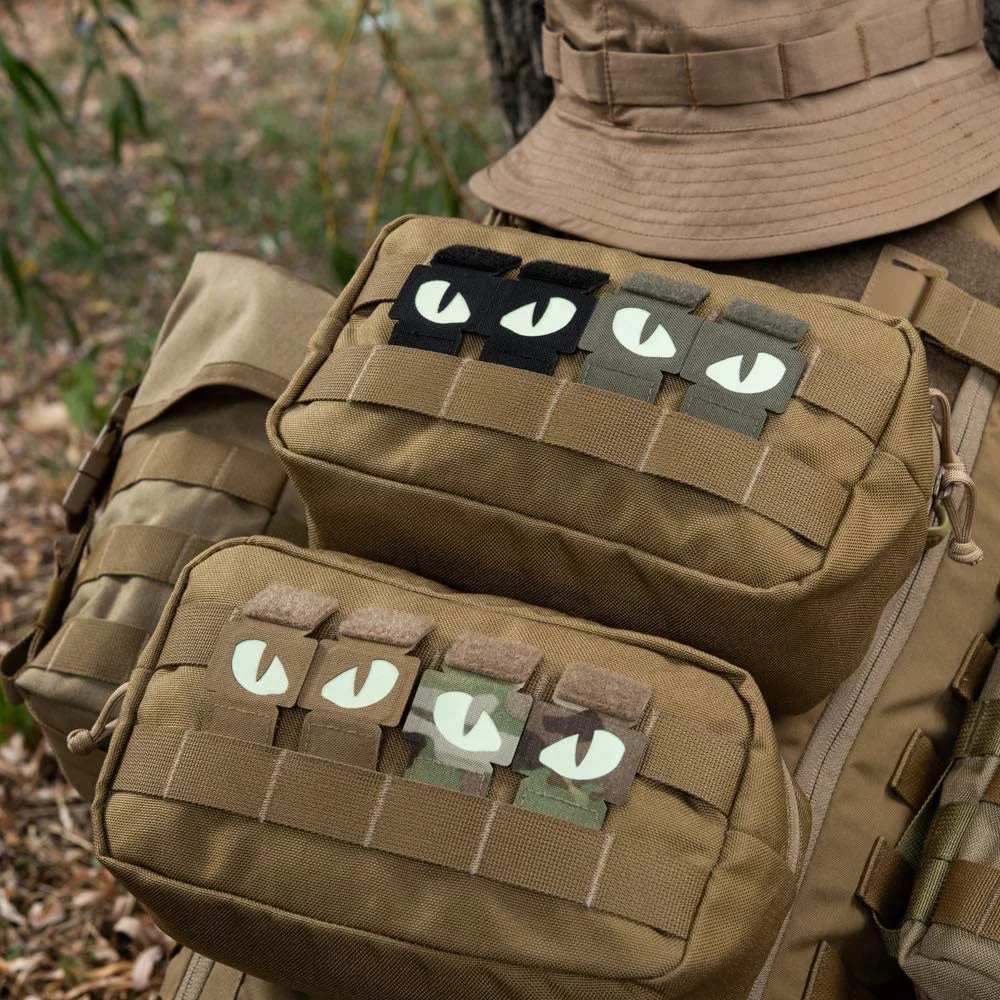 Parche luminoso ojo de gato MOLLE táctico para cinturón y mochila