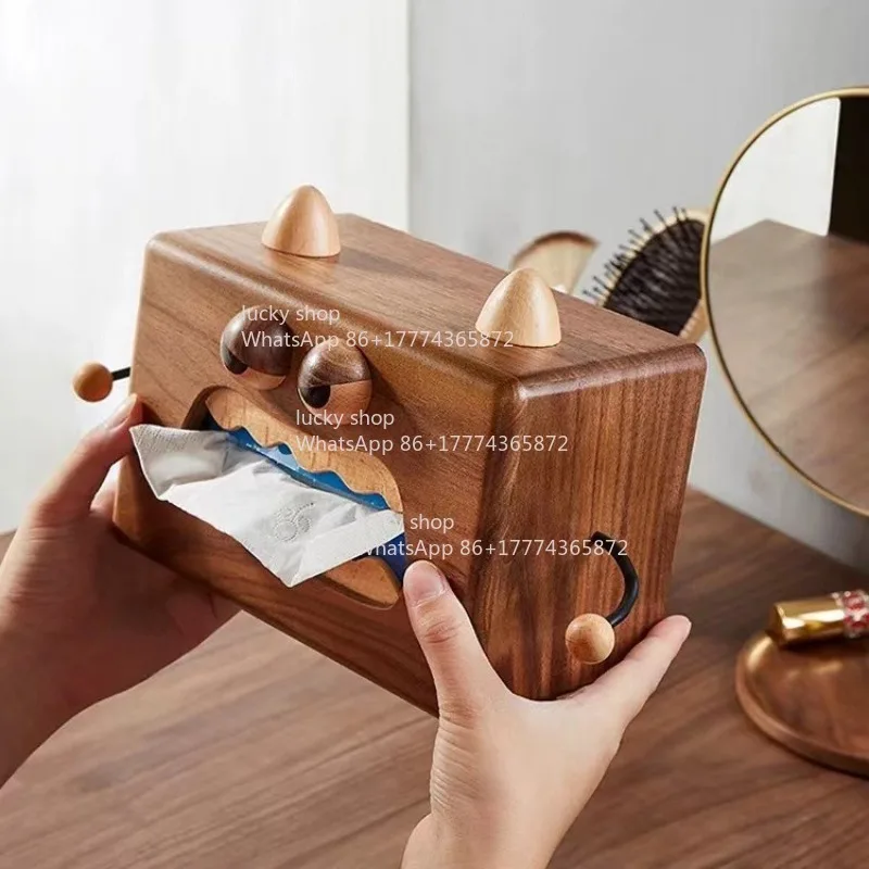 

The Little Monster-shaped Solid Wood Tissue Box Is A Small Object That Is Both Interesting and Practical.
