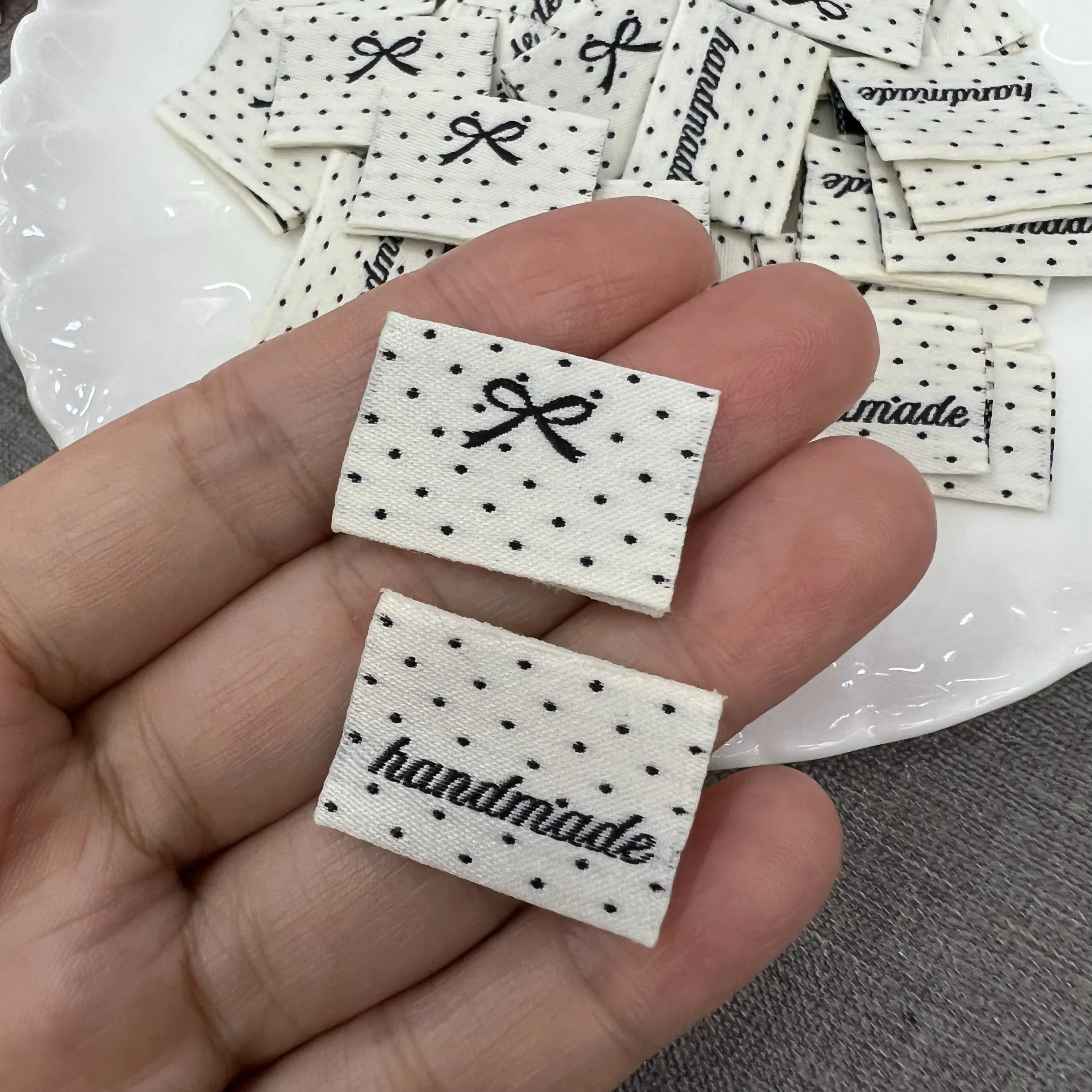 Spot polka dot bow folded in half woven label handmade, sewn cartoon washed label