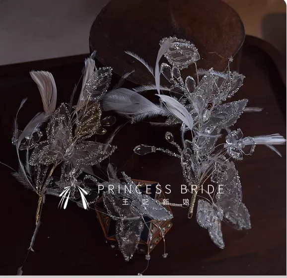 Luxury shiny silver-gray feather butterfly crystal side high sense bridal headdress wedding dress and makeup hair accessories.