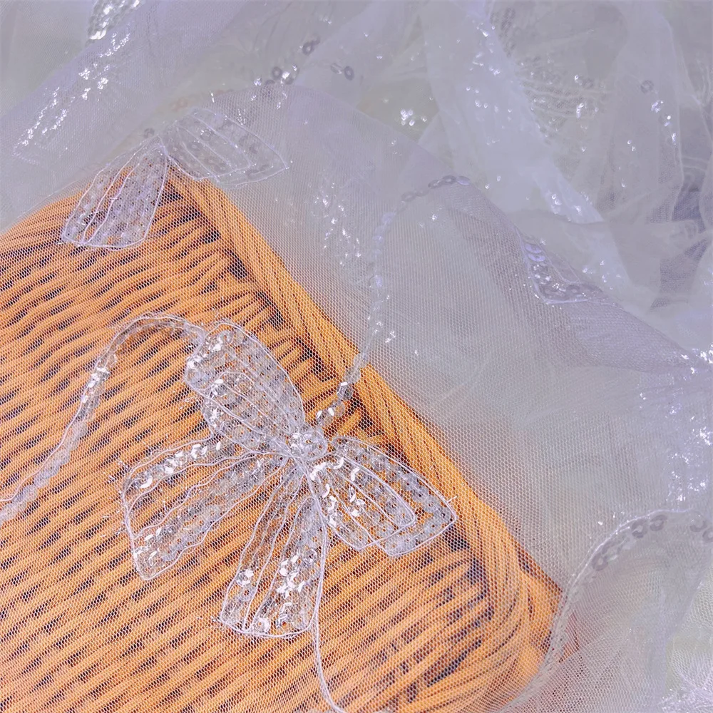 

New bow tie sequined mesh fabric, white shiny lace embroidery fabric for wedding dresses and gowns sold by the yard