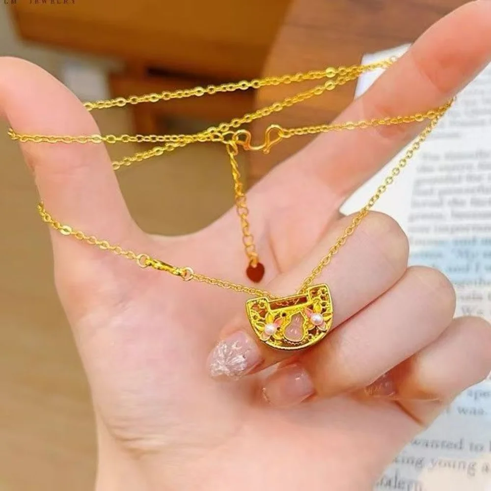 

Luxurious 24K gold ring, bracelet, necklace set with diamond-encrusted peach and cardamom design