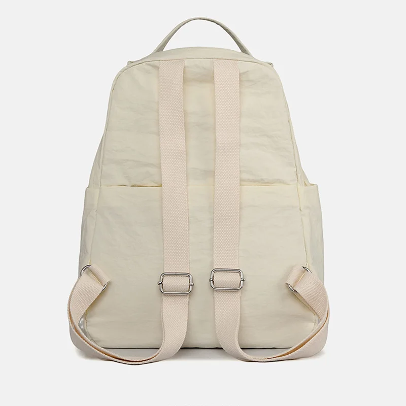 حقيبة ظهر نسائية عصرية متعددة الاستخدامات لعام 2026 حقيبة ظهر كاجوال بسيطة مقاومة للماء من قماش النايلون بتصميم بلون سادة