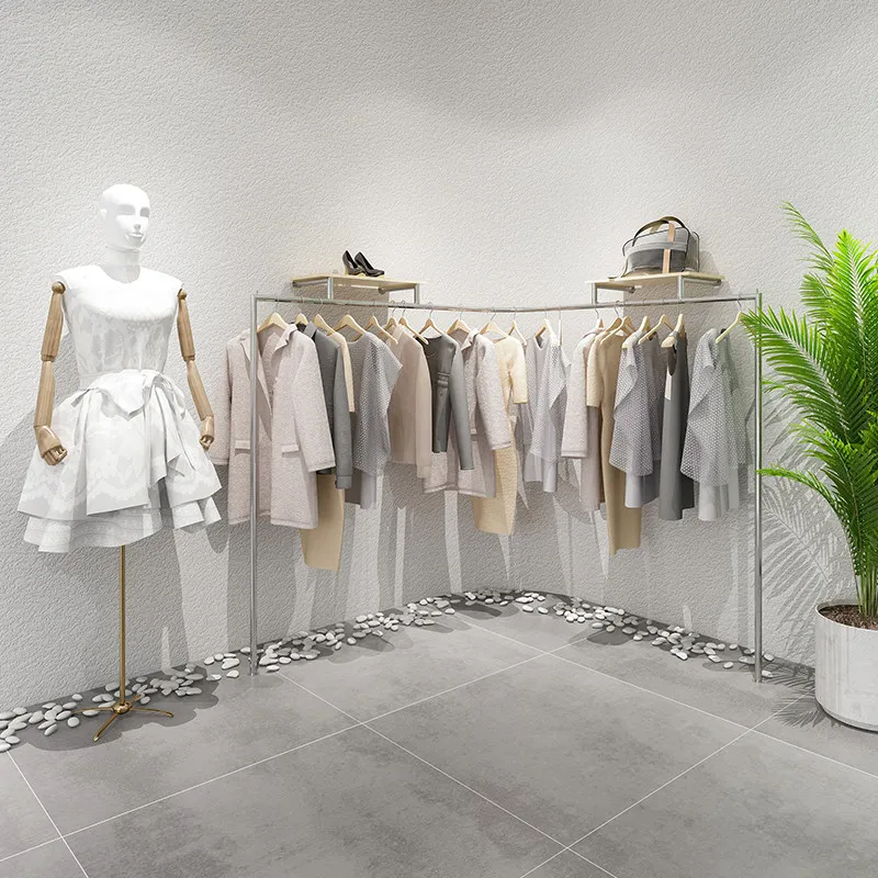 

Clothing store display shelves on the wall Stainless steel supports custom hanging clothes shelves Korean women's clothing store
