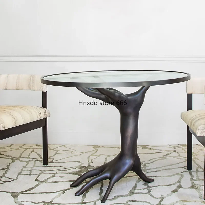 Coffee table art sculpture designer receives and negotiates round glass side table