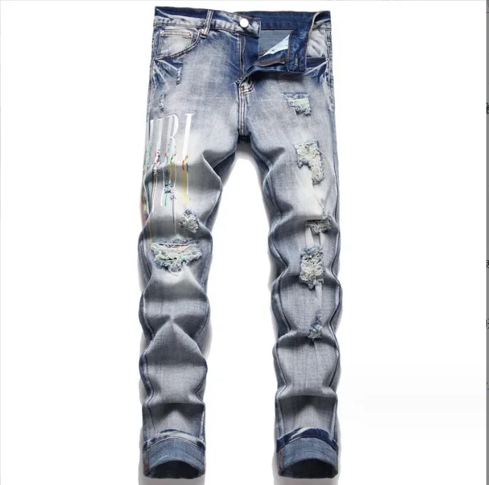 

European and American Men's New Style Jeans with Paint Embroidery, Ripped Patches and Elastic Fabric. Slim-fit and Versatile.