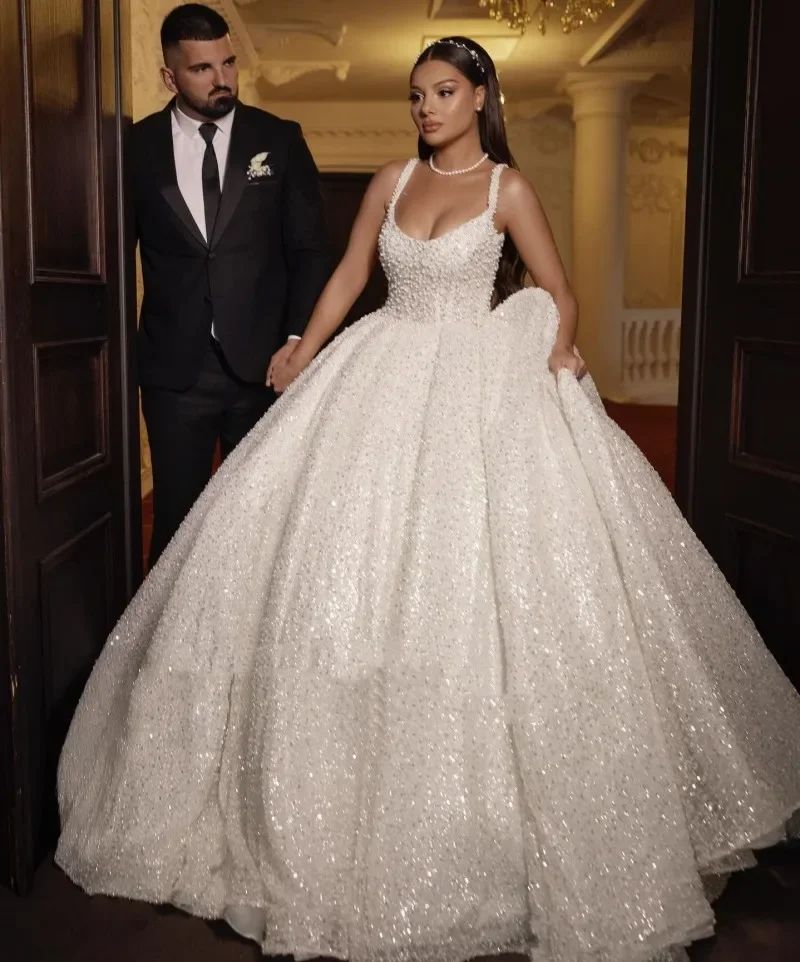 

Customized Arabic Dubai luxury Sleeveless Wedding Dresses Brides Spaghetti Straps Sequin Gowns Beading Vestido de novia boda