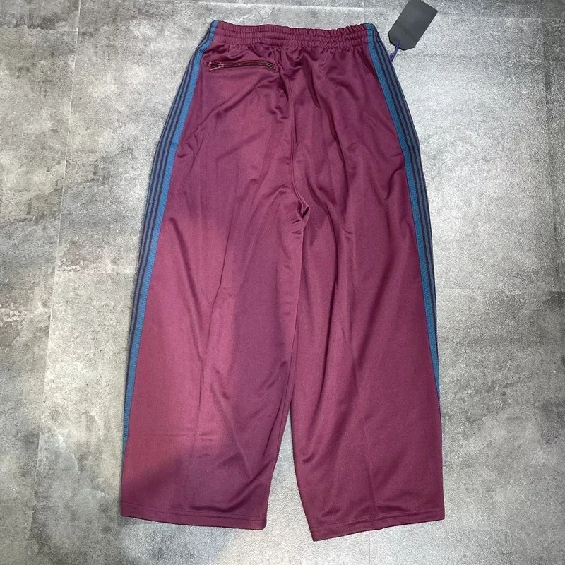 25ss เย็บปักถักร้อยผีเสื้อ Nee dles ขากว้างกางเกงลาย 1:1 Oversize Claret AWGE Casual กางเกงแท็ก