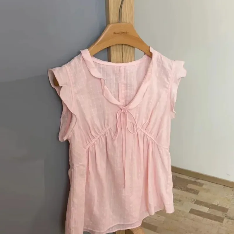 

Women's Pink Ruffled Sleeveless Blouse With Tie Neck And Pleated Waist Lightweight Casual Top