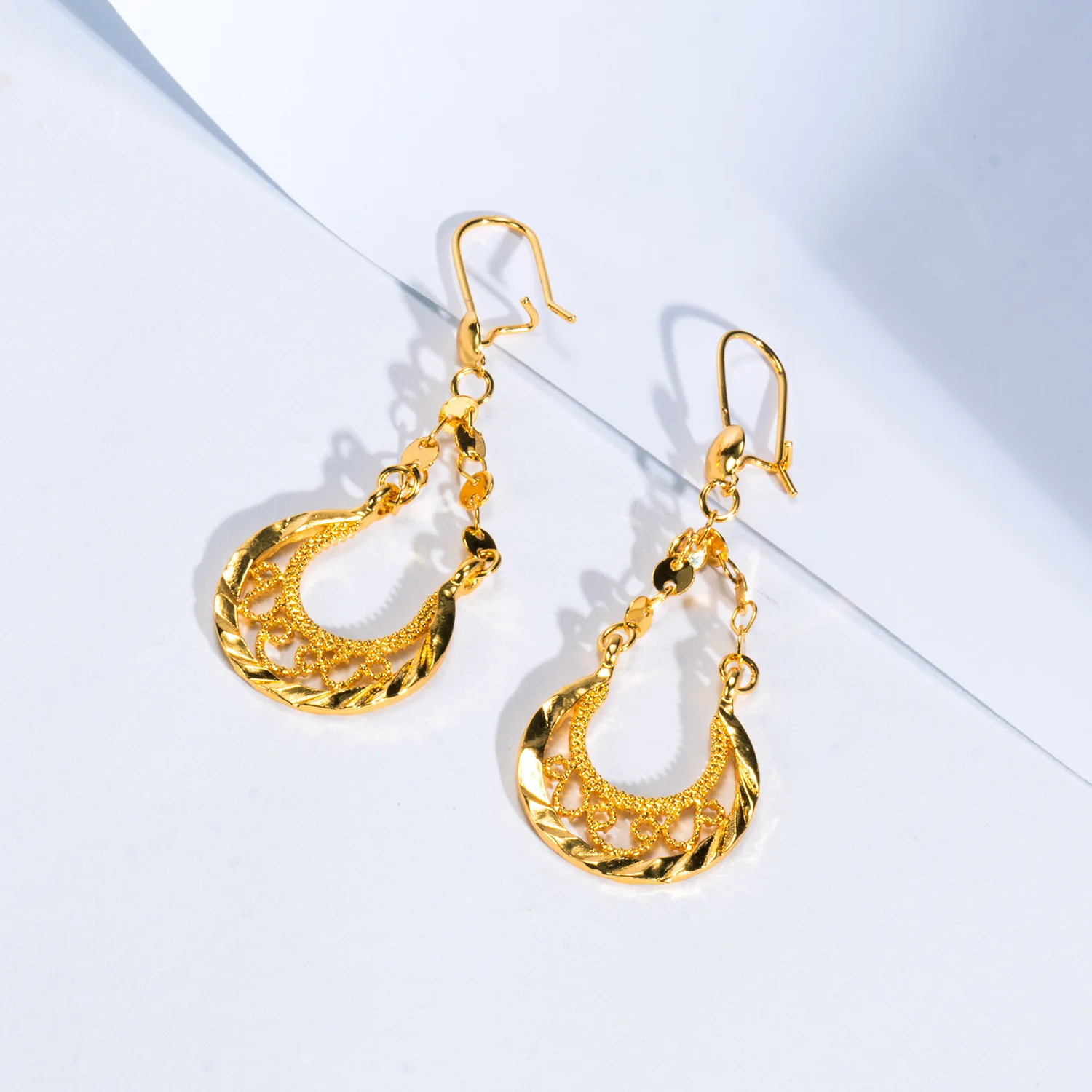 9999 gold Saudi Arabian export earrings - sophisticated moon-shaped earrings with a touch of Nigerian ethnic style