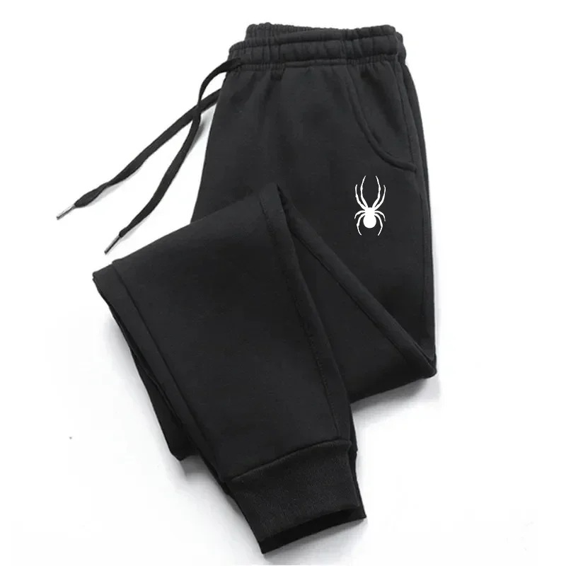 Pantalones deportivos con estampado de araña, joggers unisex con cordón, diseño minimalista con estampado de araña blanca, bolsillos laterales con dobladillo, pantalones informales de color oscuro.