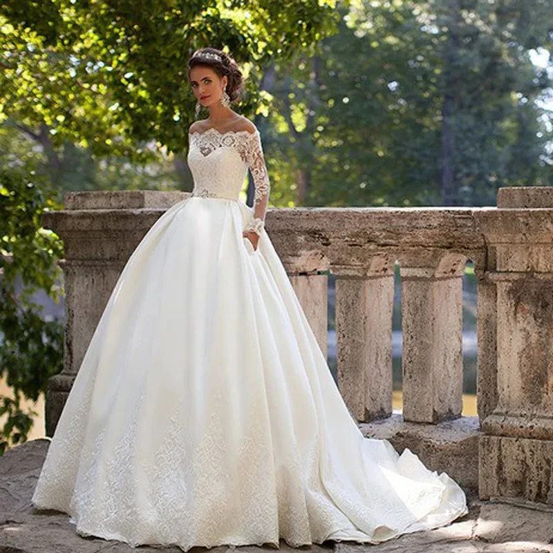 

Ivory Satin Wedding Dress With Pockets Lace Appliques Long Sleeves Illusion Boat Neck A Line Princess Wedding Gown Customized