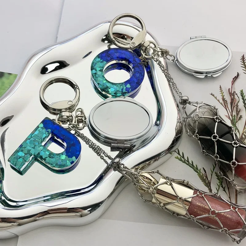 Hot Selling New Blue Letter Pendant Pendant Lipstick Net Pocket Silver Oval Mirror Keychain Gift 10PCS