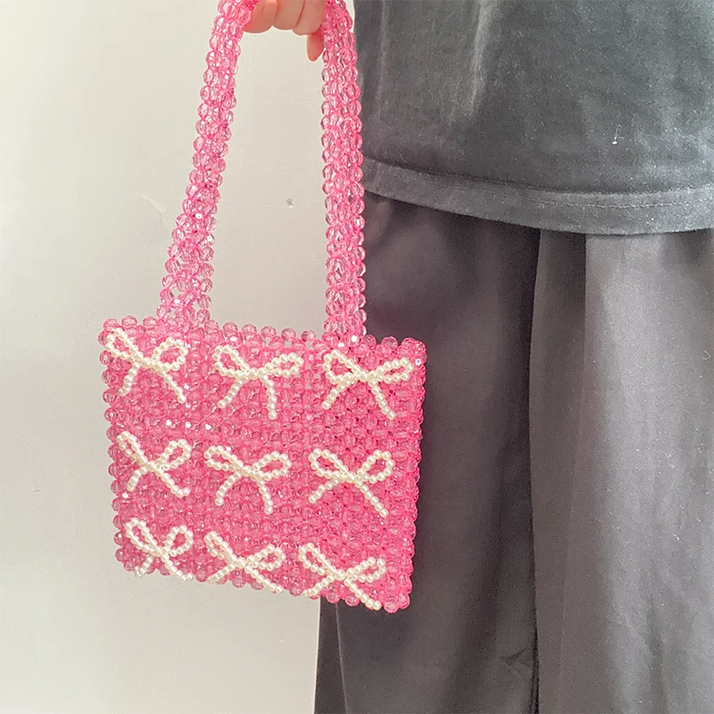 Borsa tessuta con perline acriliche rosa di nuova moda borsa a tracolla da donna con Design a fiocco di perle retrò personalizzata borsa Versatile