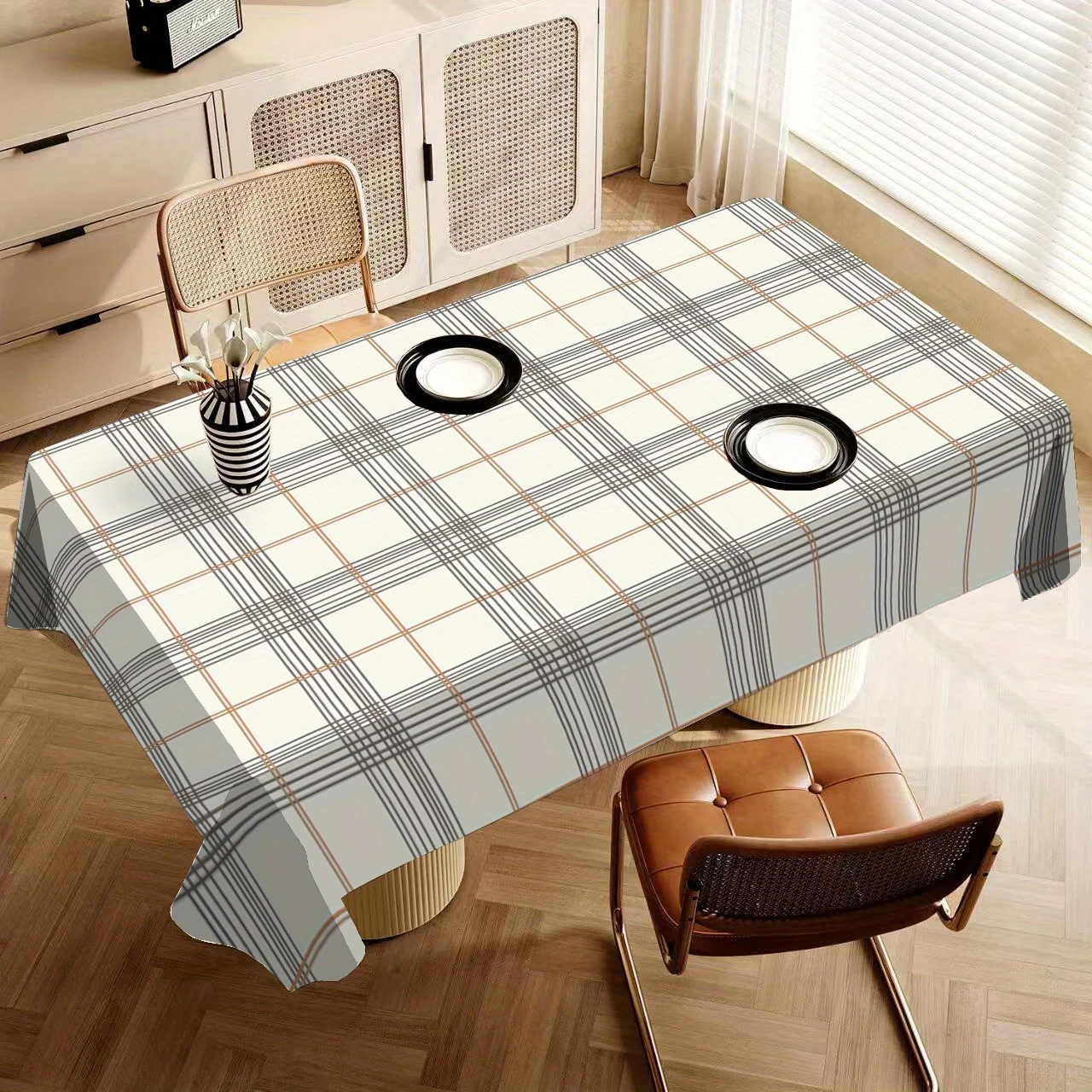 One piece of multi-functional grey and white checked polyester tablecloth is suitable for dining.