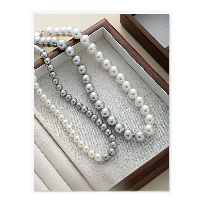 

French retro imitation pearl sweater chain simple and generous ingot buckle exquisite necklace