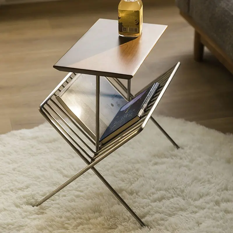 Crossed stainless steel book and newspaper rack, small coffee table and magazine, floor-to-ceiling creative bedroom, bedside