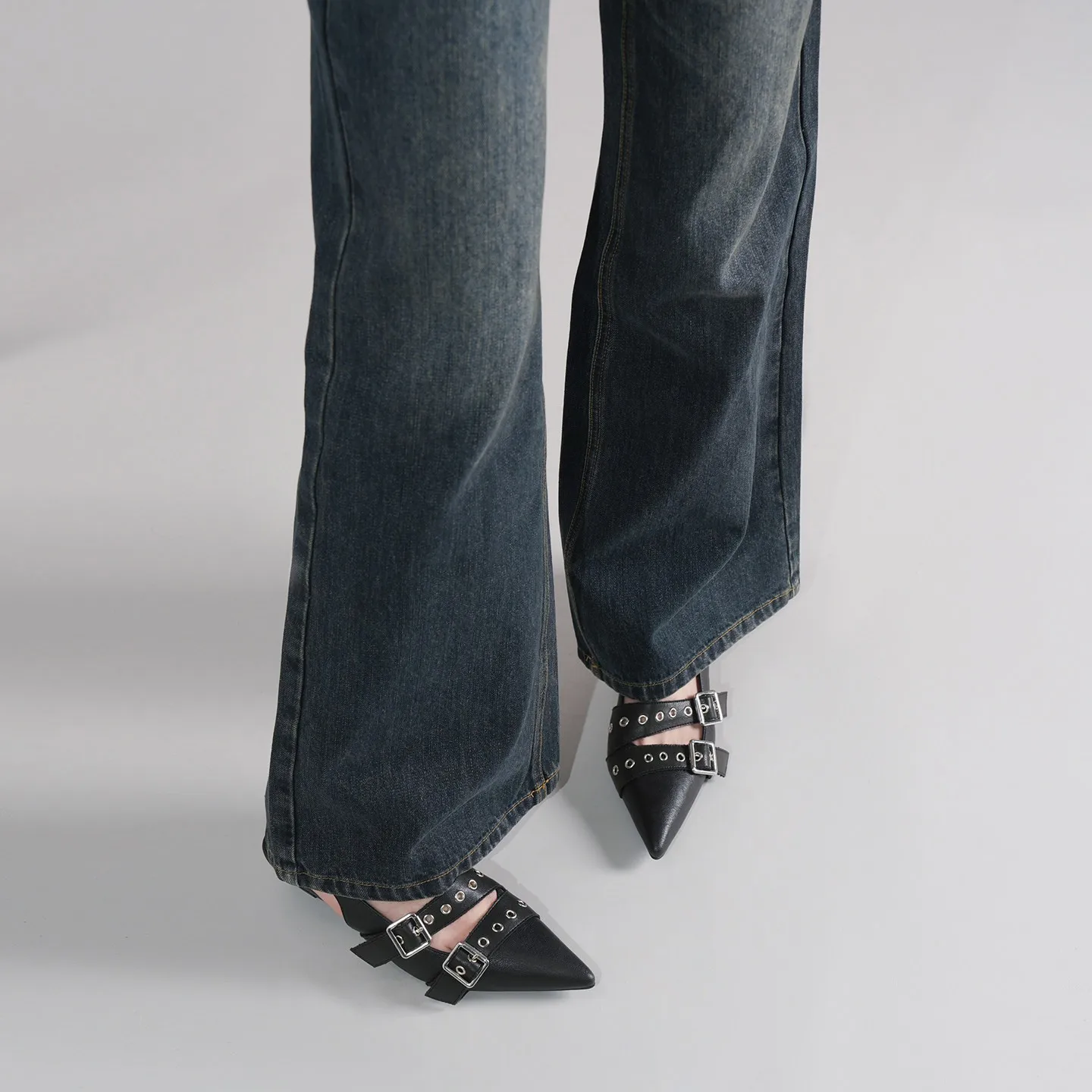 Pointed Black High Heels with A Unique Design, Metal Stud Accents, and A Single-strap Sandal Style