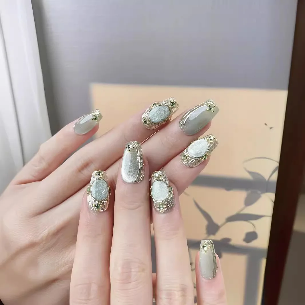 10 個手作りプレス爪ブッケラティブルーきらびやかなクリスタルキャッツアイ偽爪女性 & ガールリムーバブルウェアラブルネイルアート