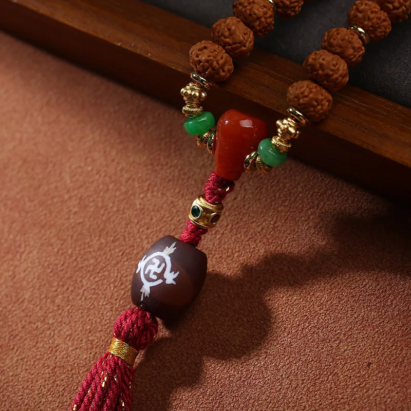 Small Rudraksha paired 108 Dzi beads, hand-held multi-loop bracelet from first-generation Tree King with ginger yello