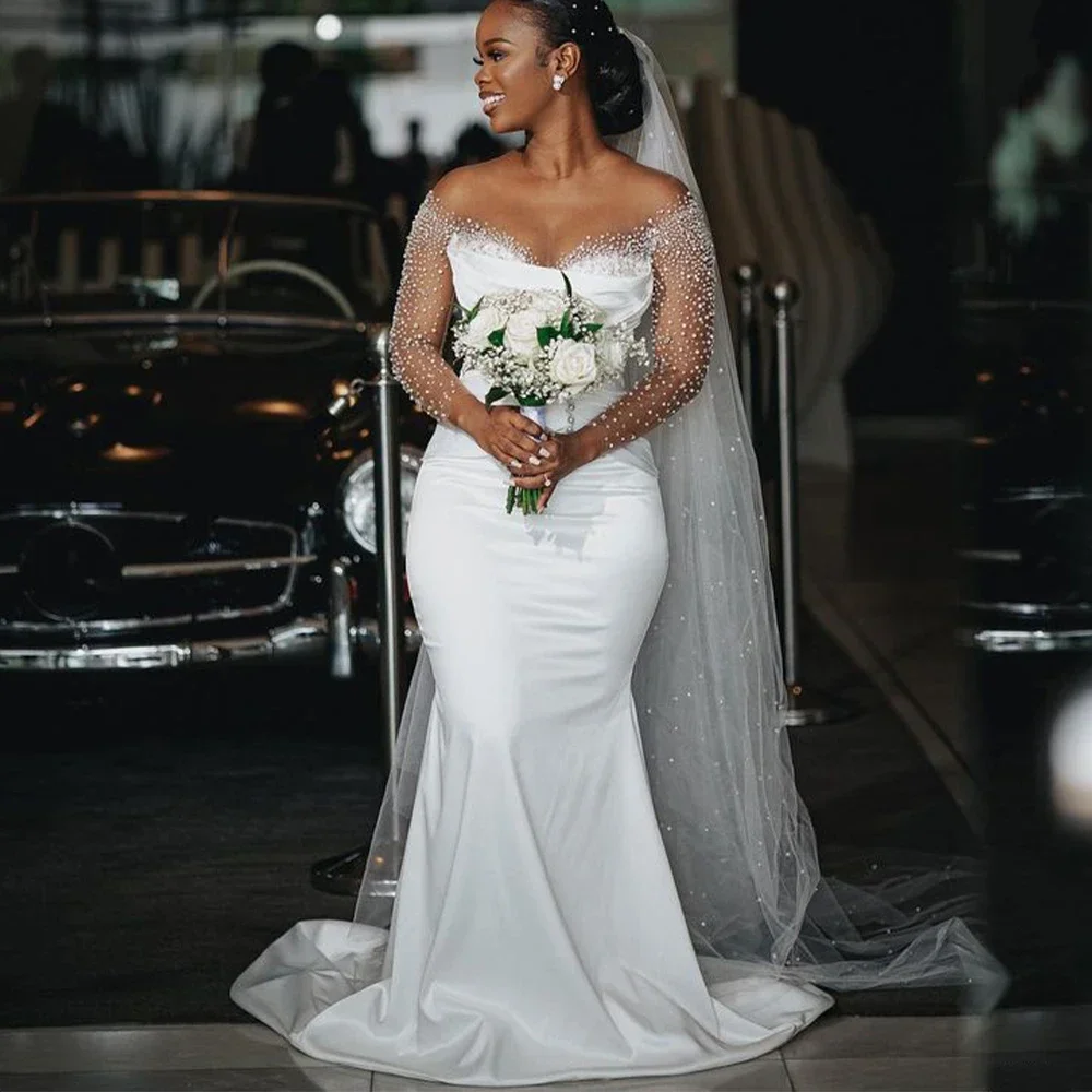 

Customized African Beading Pearls Mermaid Wedding Dresses For Bride 2024 Sweep Train Sheer Neck Illusion Long Sleeves Satin Br