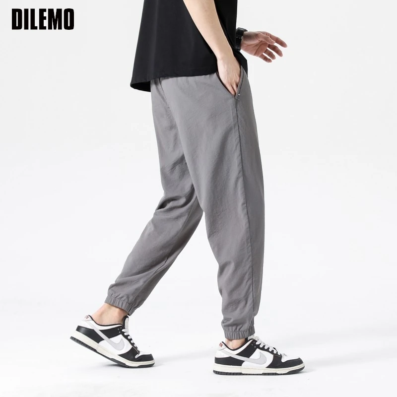 Pantalones para correr de seda de hielo de alta calidad para hombre, pantalón informal, a la moda, con tiras, holgados, de talla grande, para correr, ropa para hombre