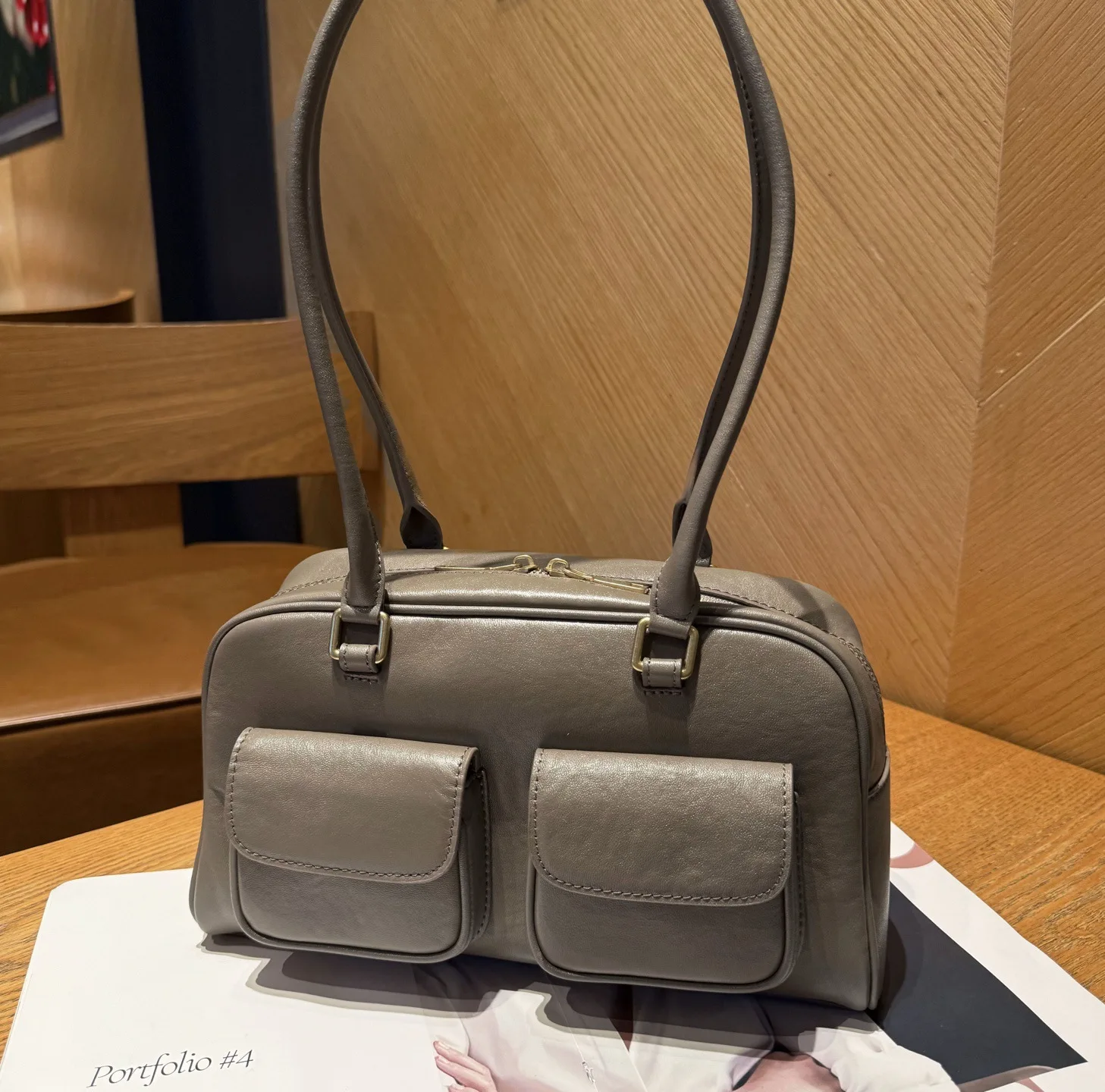 

Spacious Dual-Pocket Leather Tote. Carry handheld or on shoulder for chic, effortless style.