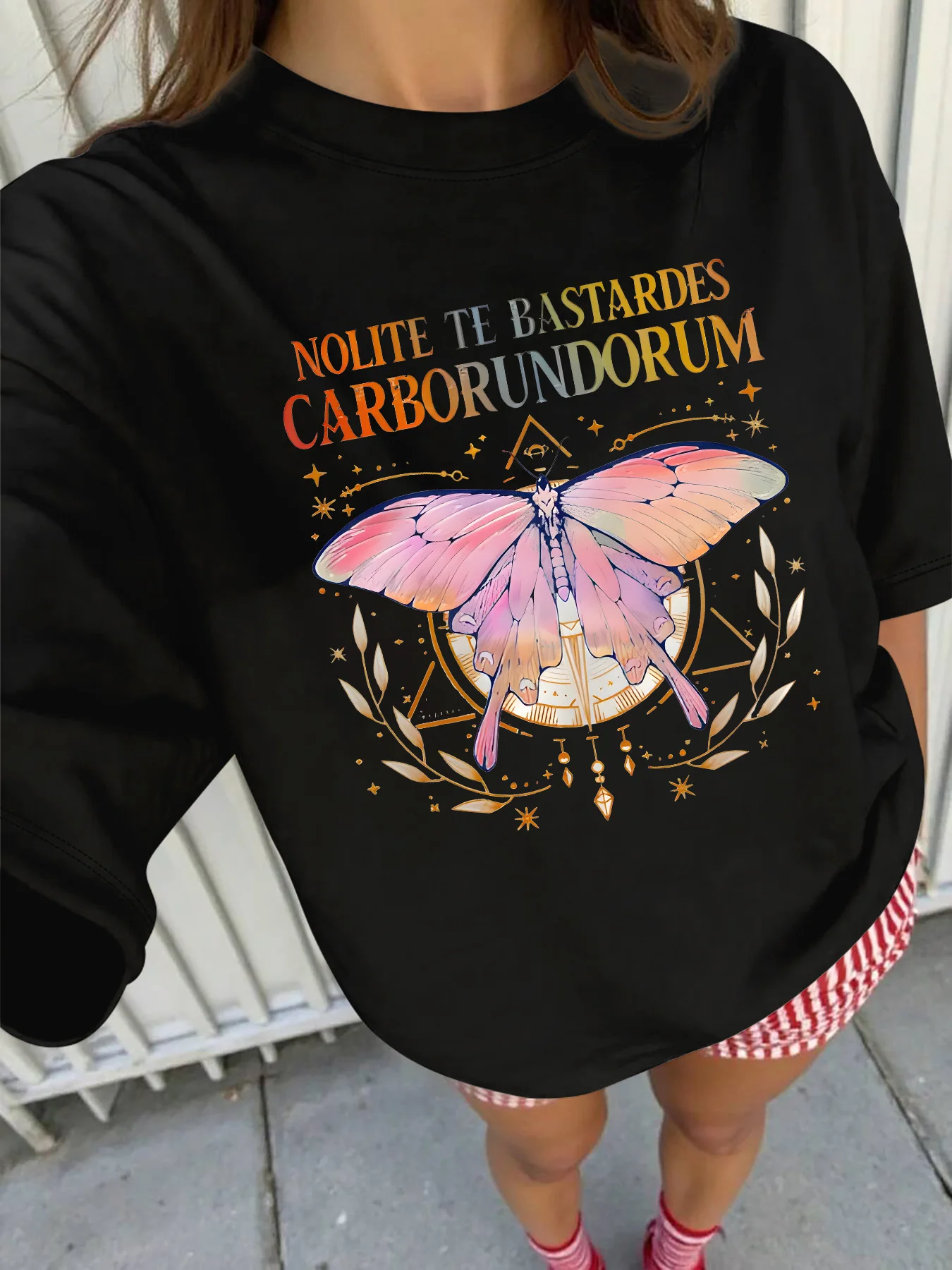 

Plus - Size Tee: “Nolite Te Bastardes Carborundorum” Butterfly & Latin Quote Graphic