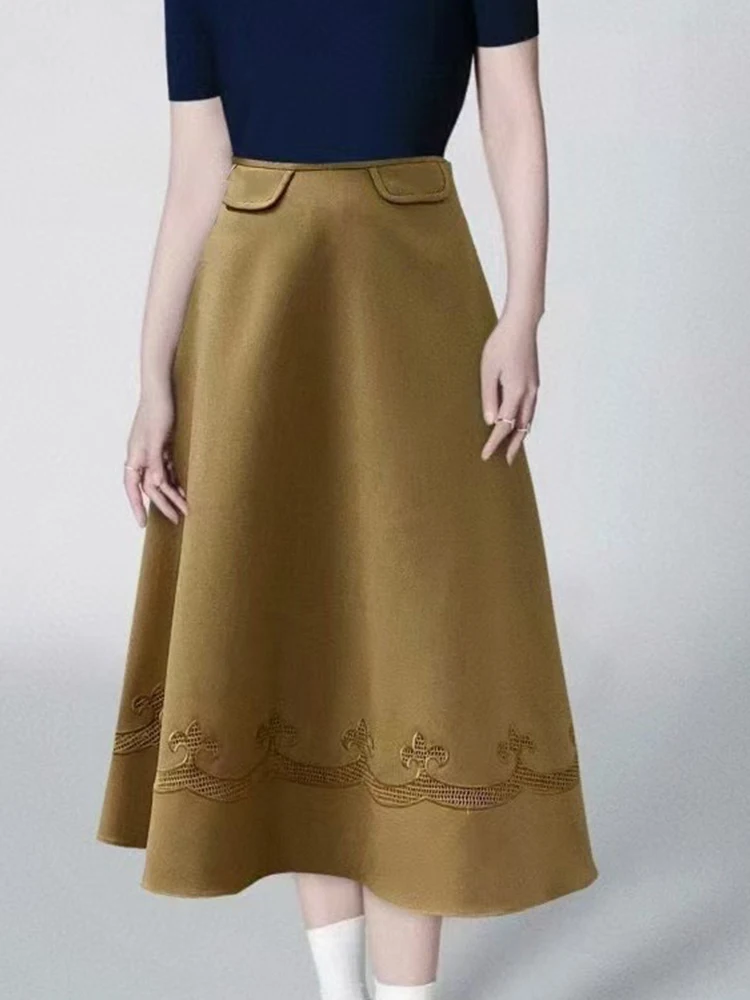 

Retro autumn new Hepburn style flip pocket decoration hem embroidery hollow fashion female A-word skirt.